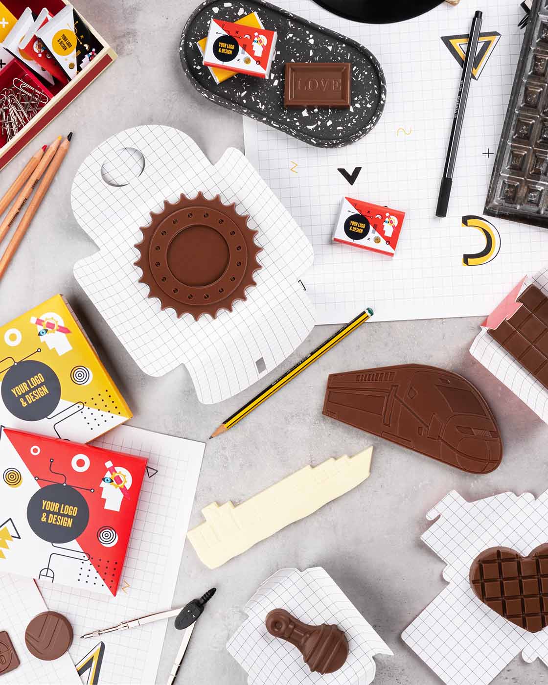 Obrazek przedstawiający słodycze reklamowe: Czekolady w indywidualnym ksztaåcie kompozycyjne